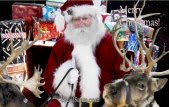 Santa in sleigh with reindeer